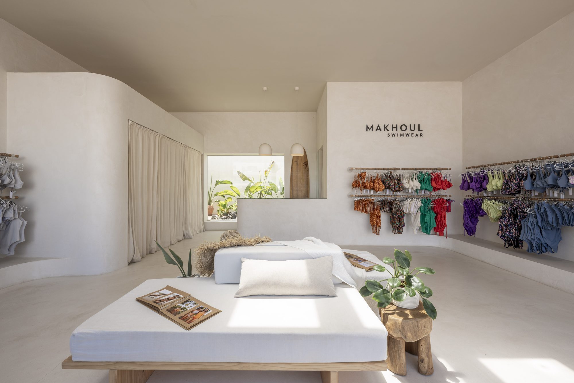 Makhoul Swimwear boutique interior with colorful swimwear on display racks