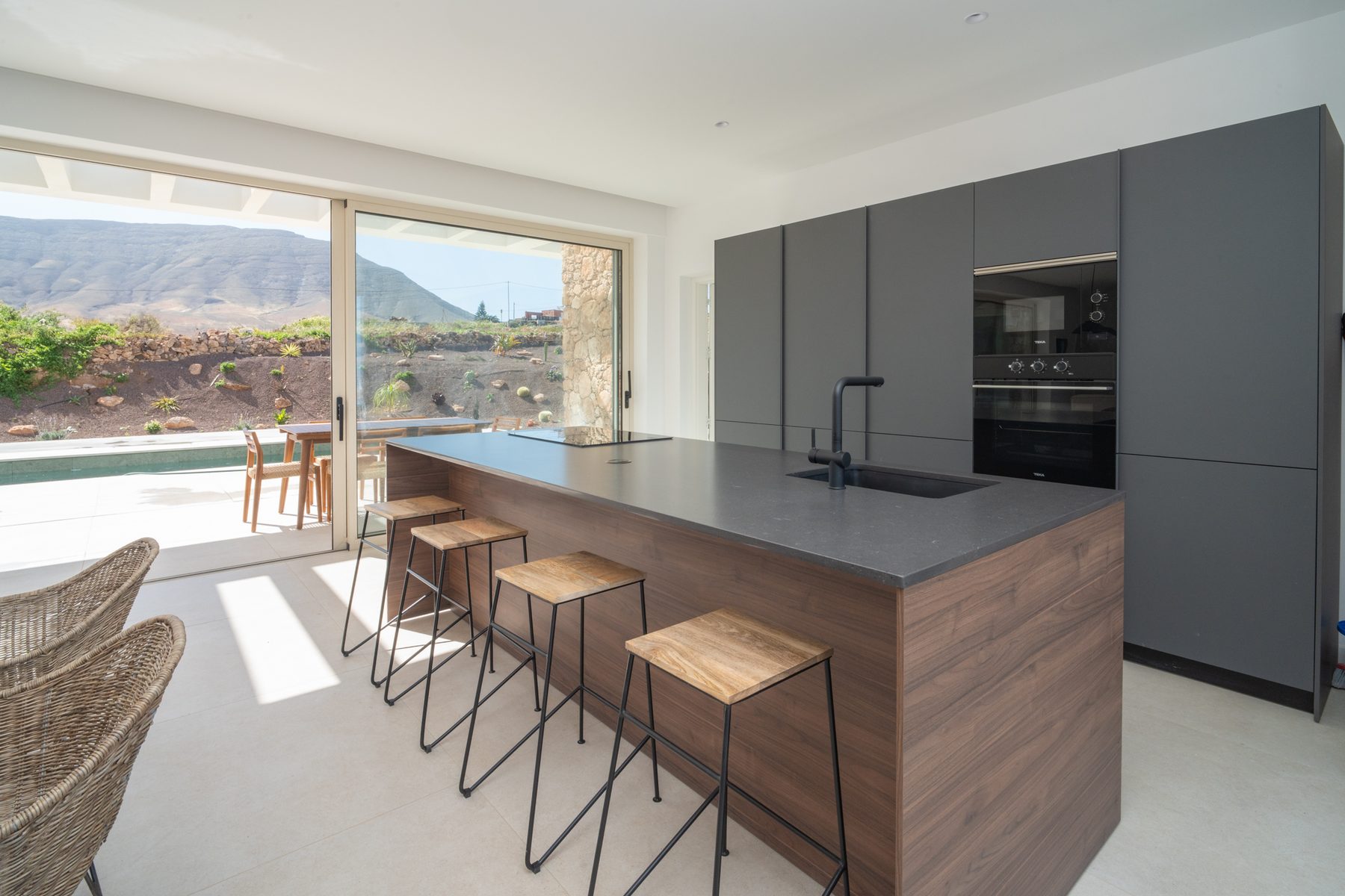Open-plan kitchen, dining, and living space with a mountain view